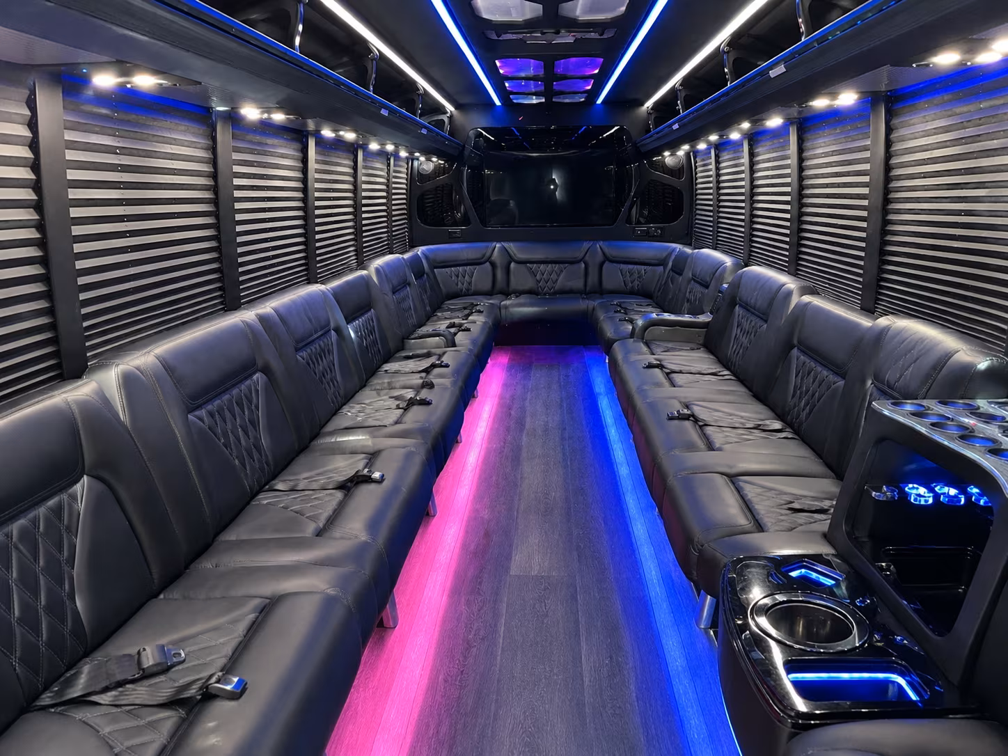 Friends laughing during a party bus celebration in Las Cruces